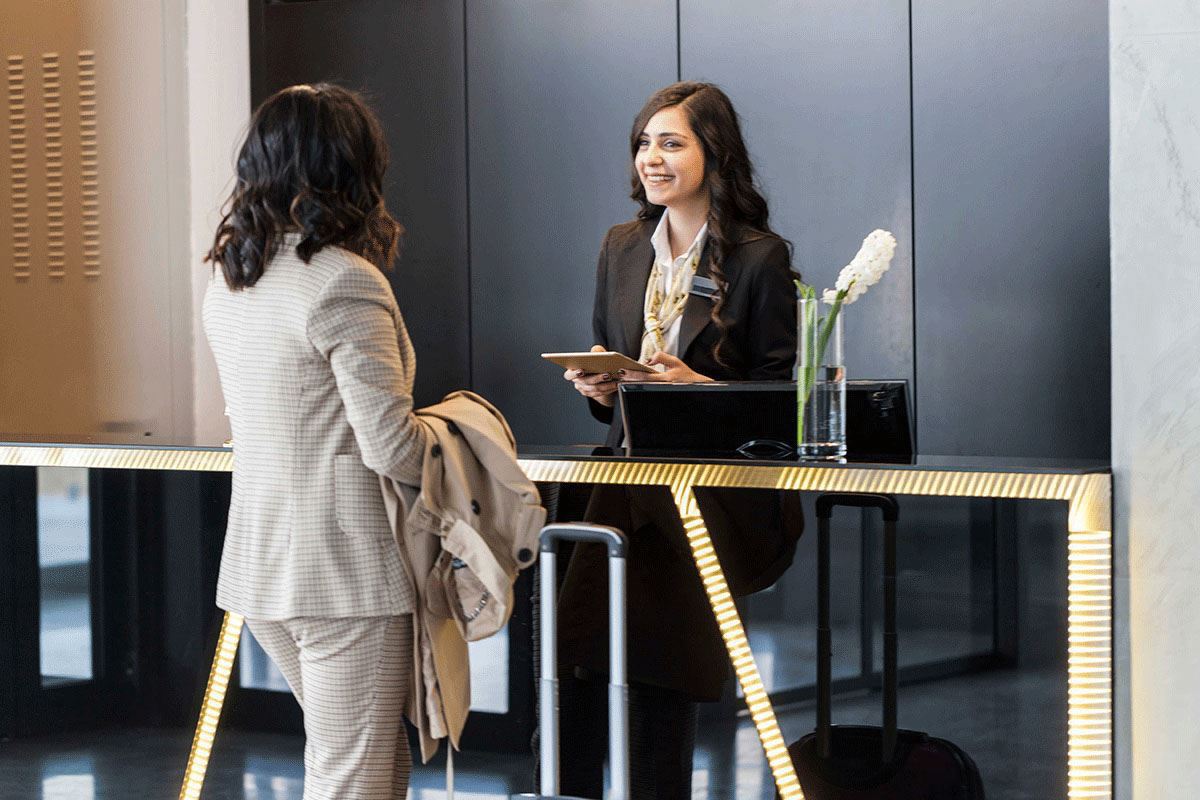 can you check into a hotel on behalf of someone else