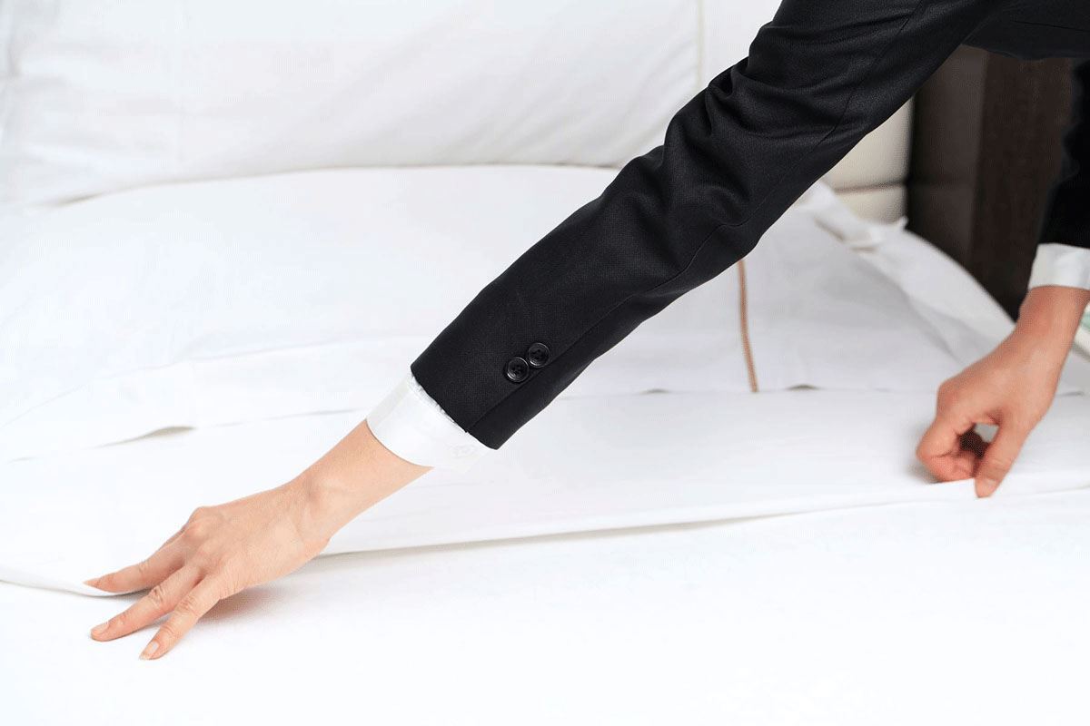 do hotels change mattress pads after every guest