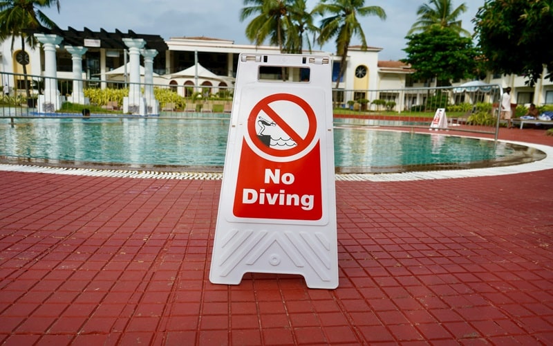Must display depth markers, 'No Diving' signs