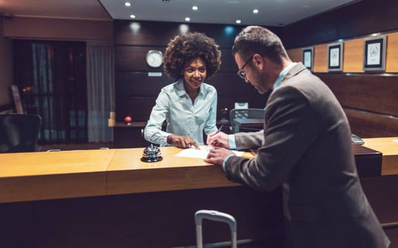 Businessman checking in late at the hotel