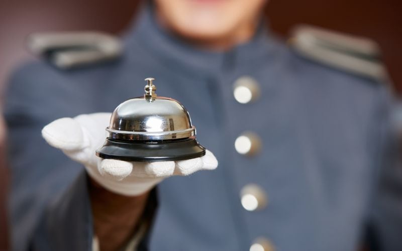 Hotel bell on hand by concierge