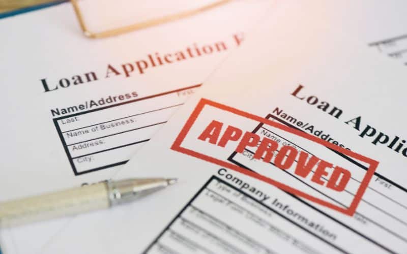 Loan application form with 'Approved' stamping